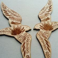 Pair of etched wooden birds
